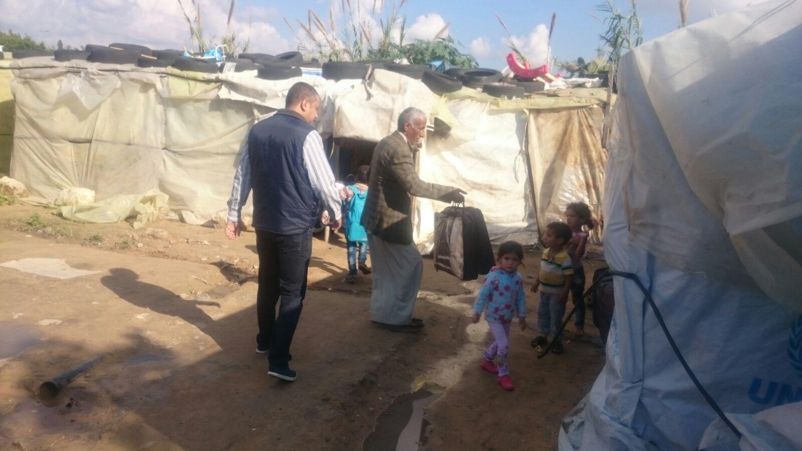 missionaries deliver blankets to children in a refugee camp in syria